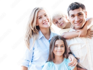 Happy family, a mother, father, and two children outside smiling