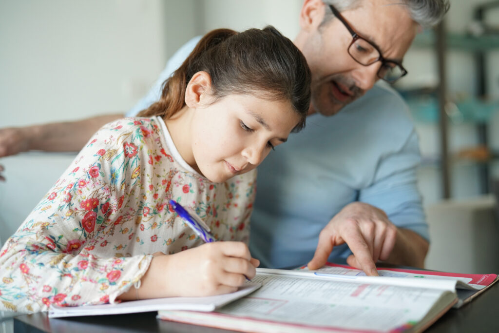Man Helping Daughter With Homework