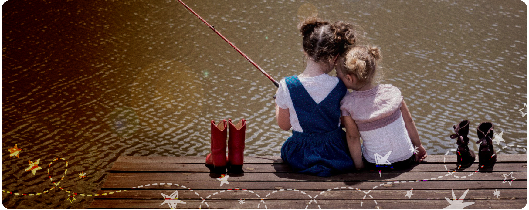Two young girls sitting on a wooden dock, fishing and enjoying each other's company, with colorful rain boots beside them, reflecting the theme of safety and love for children.